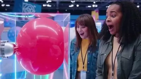 AI Video from prompt: two women, their chests grow to enormous sizes