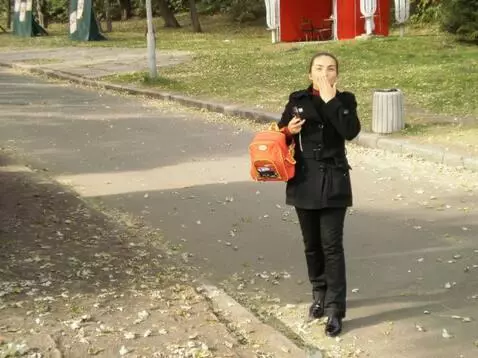 AI Video from prompt: The girl waves with her left hand, blowing kisse