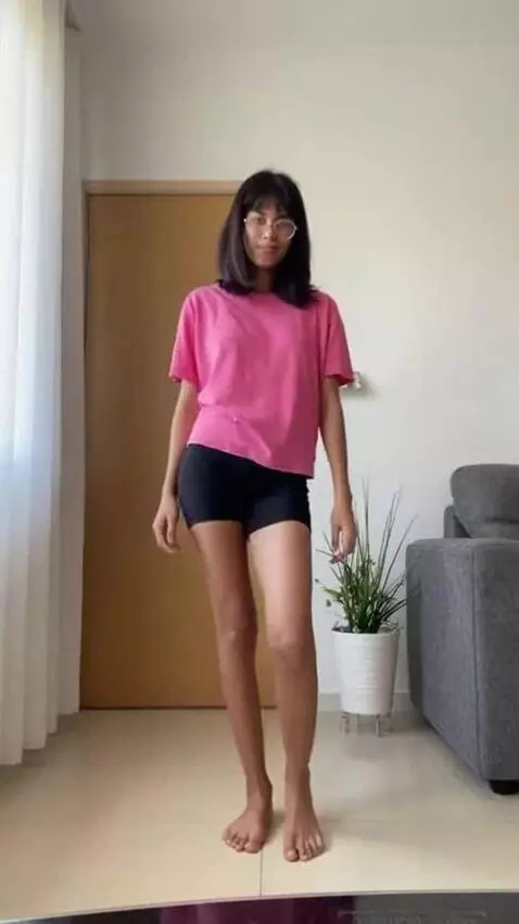 AI Video from prompt: A skinny 18 yo brazilian girl, pink t-shirt than