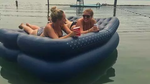 AI Video from prompt: The blue air mattress inflates to an enormous si
