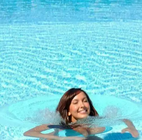 AI Video from prompt: The girl dives into the water to cool off, then 
