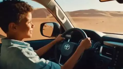 AI Video from prompt: "I want a video of this child driving a Toyota L