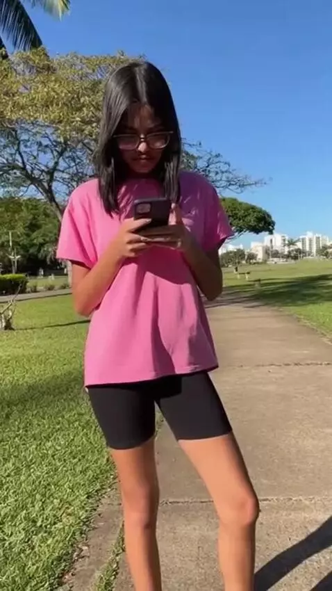 AI Video from prompt: A skinny 18 yo girl from Aracaju, pink t-shirt t