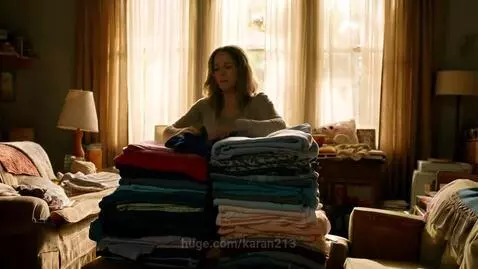 Mom folding laundry, kids run in screaming and knock it over, mom looks shocked.