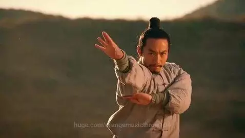 Martial artist performing Praying Mantis Kung Fu with a mantis claw hand shape outdoors.