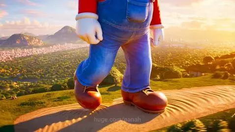 Giant animated Super Mario in red shirt and blue overalls walking on a grassy hill with a city and mountains in the distance.
