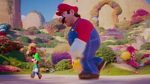 Giant Mario (30.6ft) walking towards and hugging his much smaller brother Luigi (5.9ft) in a vibrant, animated world.