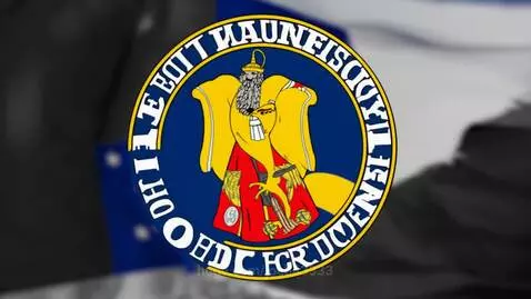 Circular emblem with a robed figure and text, associated with intelligence agencies and the Jesuit Order flag.