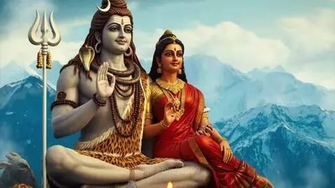 Lord Shiva and Mother Parvati seated together with snow-capped mountains in the background.