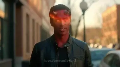 A man with devil features transforms into a normal-looking man smiling on an urban street.