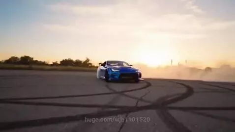 Blue sports car drifting with heavy tire smoke, sunset in the background.