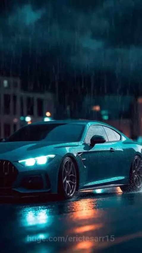 A teal sports car parked on a wet street at night with rain falling and lightning in the stormy sky.