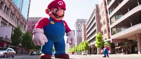 Giant animated Mario character towering over a normal-sized Luigi on a city street with buildings and trees.