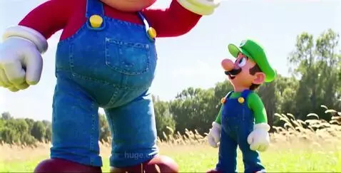 Giant Mario and regular-sized Luigi standing in a green field under a blue sky.