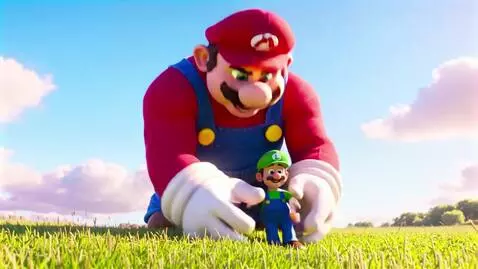 Giant Mario gently holding his smaller brother Luigi in his hands in a grassy field.