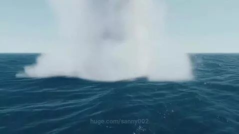 A large white column of water erupts from the deep blue ocean surface, indicating an underwater explosion.
