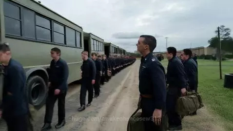 Cadets in uniform arriving at Command School, met by a shouting instructor.