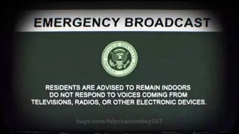 VHS screen displaying an emergency broadcast with static, scanlines, and distorted text.