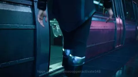 Hooded girl in cyberpunk attire walks towards a futuristic train with glowing turquoise and magenta interior.