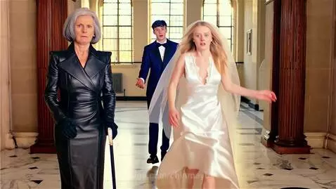Bride in white dress running distressed from fiancé and stern older woman in black leather dress.