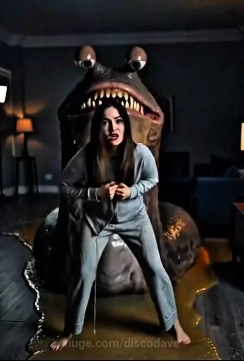 A monstrous slug-like creature emerging from a dark room, attacking a screaming woman.