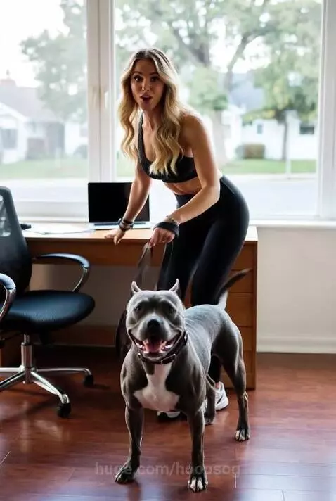 Woman in workout clothes smiling, ready to run with her dog on a leash in a home office.
