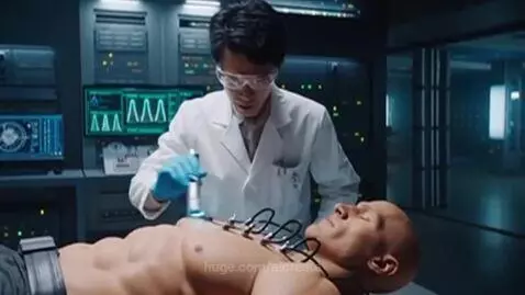 Muscular bodybuilder performing a heavy deadlift after being connected to science equipment in a futuristic lab.