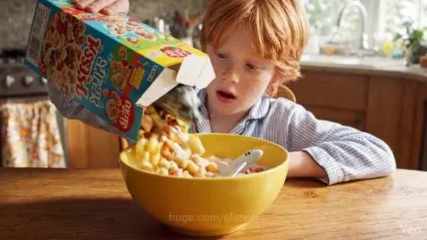 Boy's surprised face as a baby seal pops out of his Trix cereal bowl.