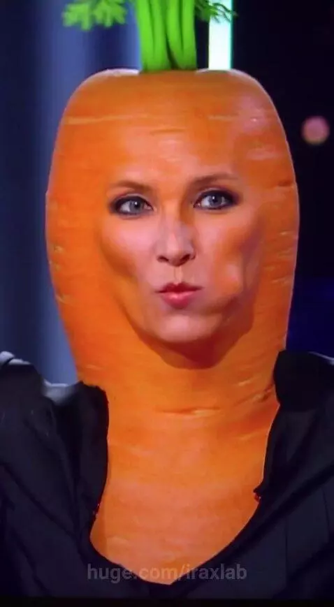 Woman in a carrot costume with green leaves on her head, looking surprised as her skin turns orange.