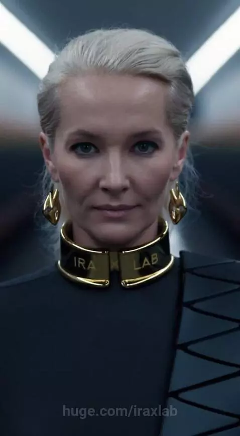 A blonde woman in a black outfit with a gold 'IRA LAB' collar is multiplied into a long, symmetrical line in a futuristic hallway.
