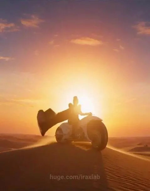 Blonde woman in futuristic suit and cape riding a white motorcycle across a desert at sunset, with pyramids in the distance.