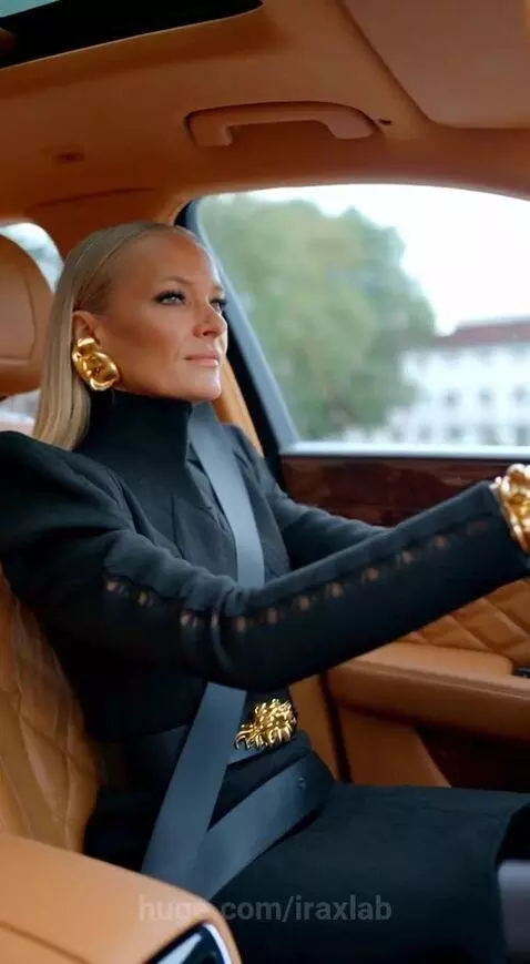 Stylish woman driving a luxury car with a hyena in the backseat, the hyena is laughing with its mouth open.