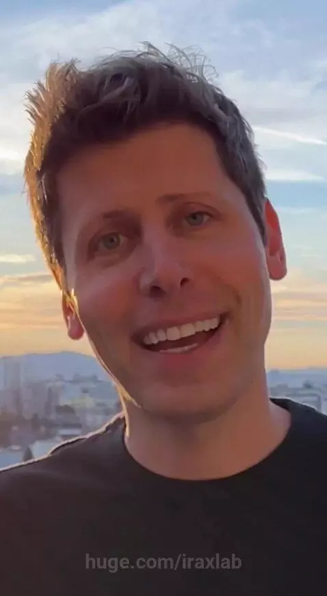 Man on a rooftop balcony smiling at the camera with a beautiful city skyline sunset in the background.