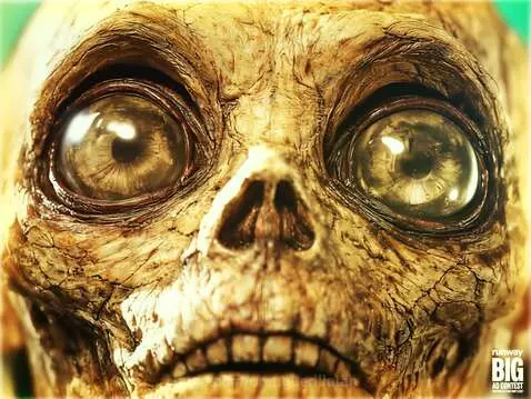 Skeletal figure with chest open revealing a battery, in a surreal, dimly lit setting.