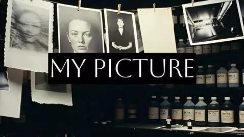 Black and white silhouette of a person in an urban setting, with a hint of color, evoking mystery and melancholy.