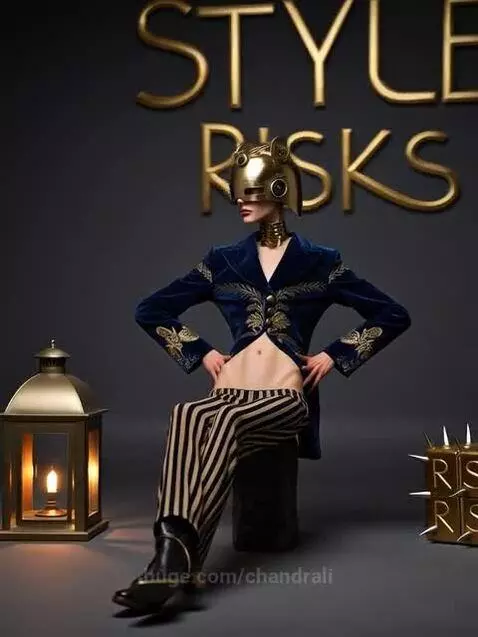 Person in avant-garde steampunk fashion with golden helmet, choker, and embroidered jacket against a dark background.