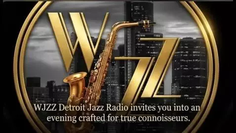 Dwight Adams performing jazz on stage with a trumpet, spotlights on him.