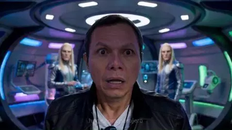 Memo Gurrola performing rock music with a band on a red alien planet with UFOs in the sky.