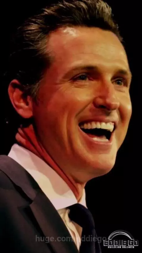 Devil figure on stage criticizing California Governor Newsom's spending on taxpayer-funded surgeries.