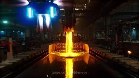 Molten gold pouring from a machine into molds on a conveyor belt in a factory, with drones overhead.