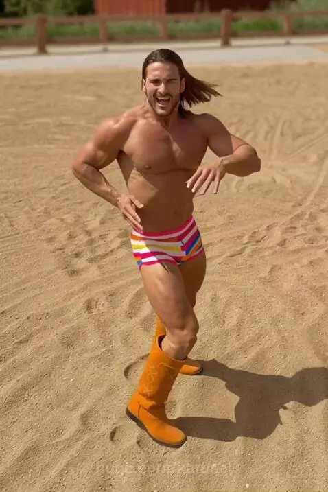 sexy man dancing on a beach by karusel