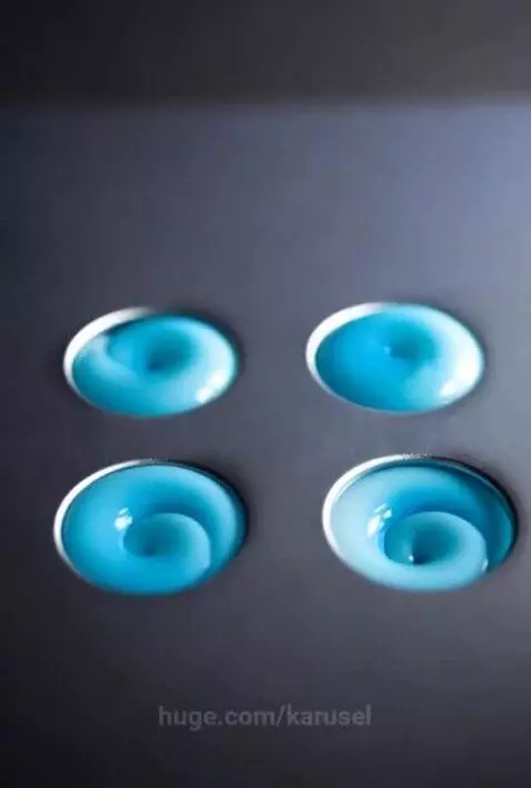 A photograph of four round holes with pale blue glowing syru... by karusel