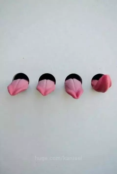 A photograph of four round holes with pale blue glowing syru... by karusel