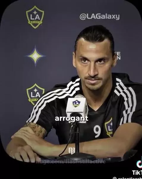 Zlatan Ibrahimović smiling confidently in a locker room setting, with a lion emoji overlay.