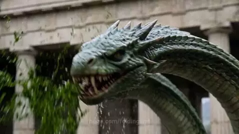Female warrior in armor fighting a multi-headed hydra in ancient ruins with water splashing.