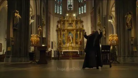 A friar priest celebrating mass by mia