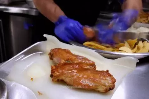 Fowls preparing  and serving chicken, chips and rice at KFC ... by bern