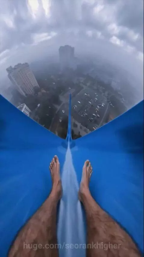 First-person view of a water slide descent, transitioning to a freefall, then a person waking up screaming.