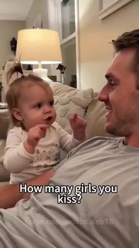 Young girl with pigtails asks her dad a funny question about kissing, he playfully denies kissing anyone but 'Mommy'.