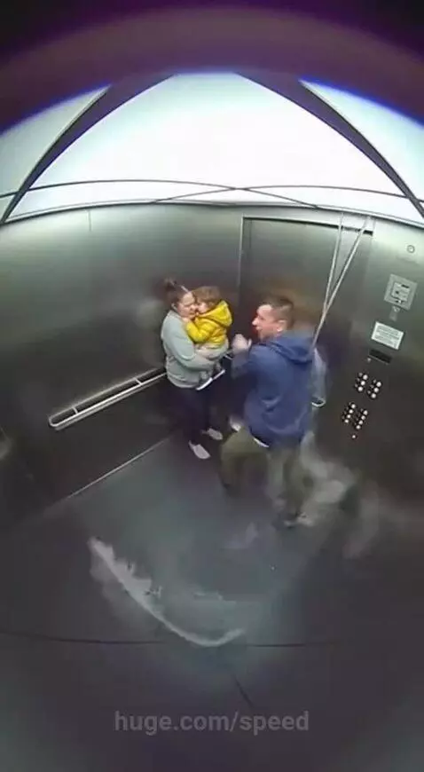 Man, woman, and child trapped in a rapidly flooding elevator filled with white foam.